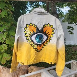 Upcycled evil eye denim jacket